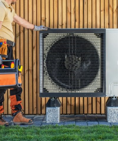Hvac,Technician,Standing,Next,To,An,Air,Conditioning,Unit,Installed